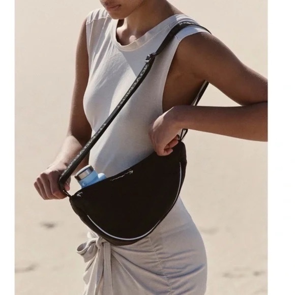 FP Movement by Free People Handbags - Free People Bulls Eye Sling Bag. Color black. MSRP $40